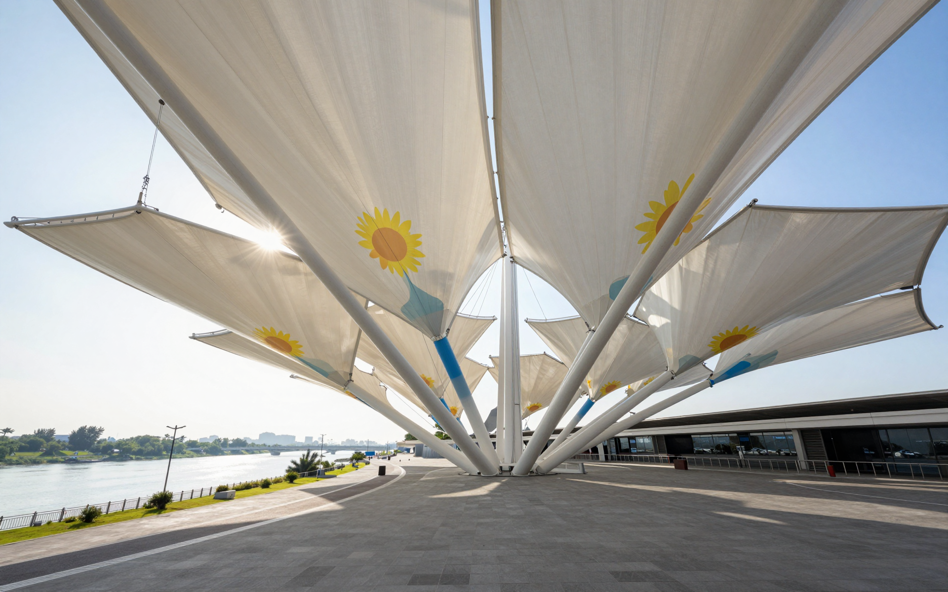 Sunflower Canopy Pavilion Along a Bright Waterfront Promenade