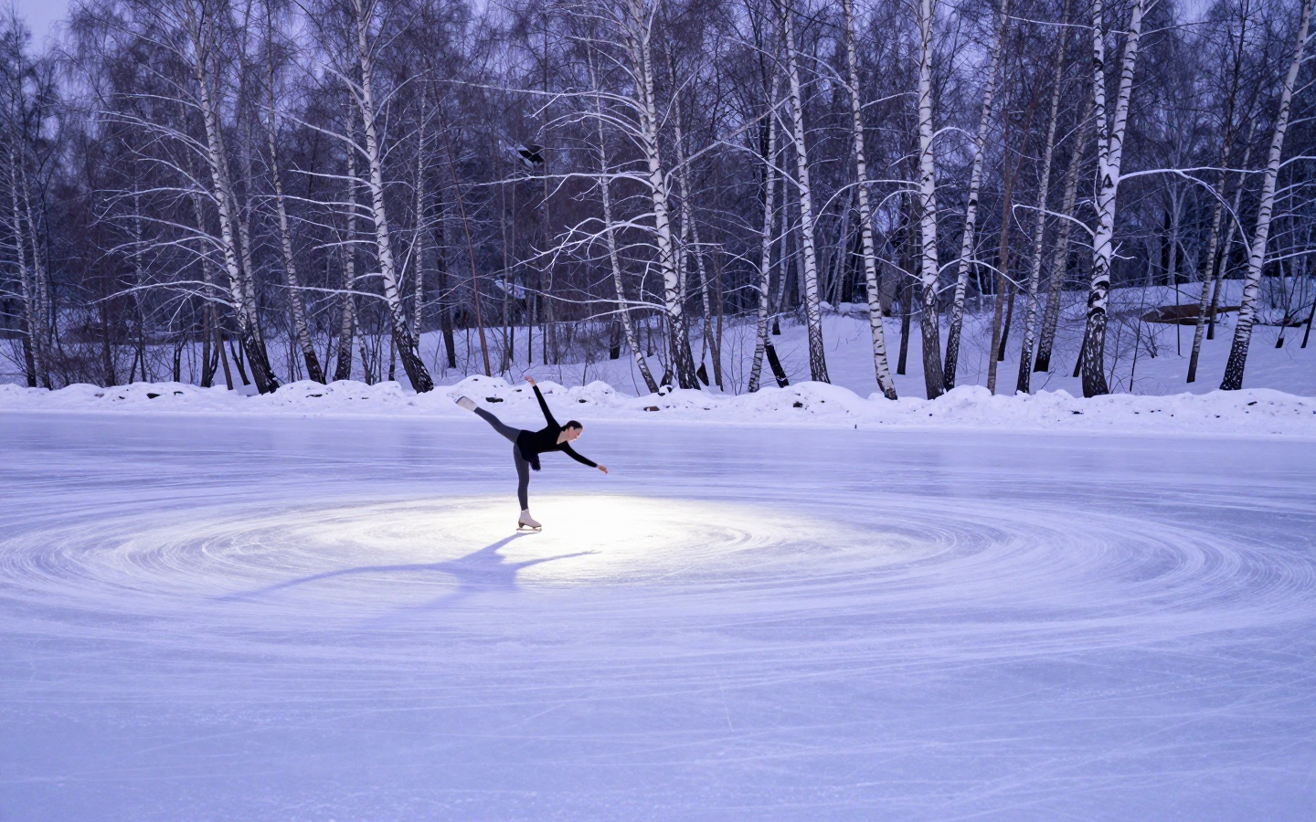 Figure Skater Spinning on a Snow-Covered Frozen Lake