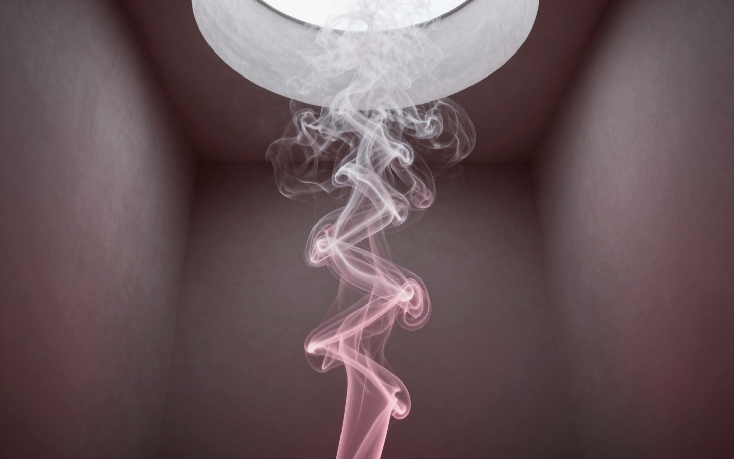Delicate Pink Smoke Swirling Beneath a Glass Bowl