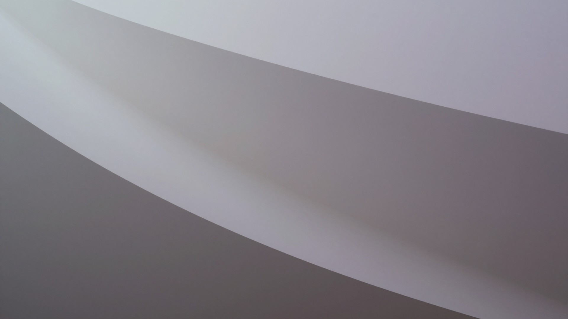 Abstract Curved White Ribbon Across Soft Gray Gradient